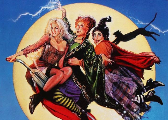 Hocus Pocus movie art featuring three witches flying on a broom in front of a moon